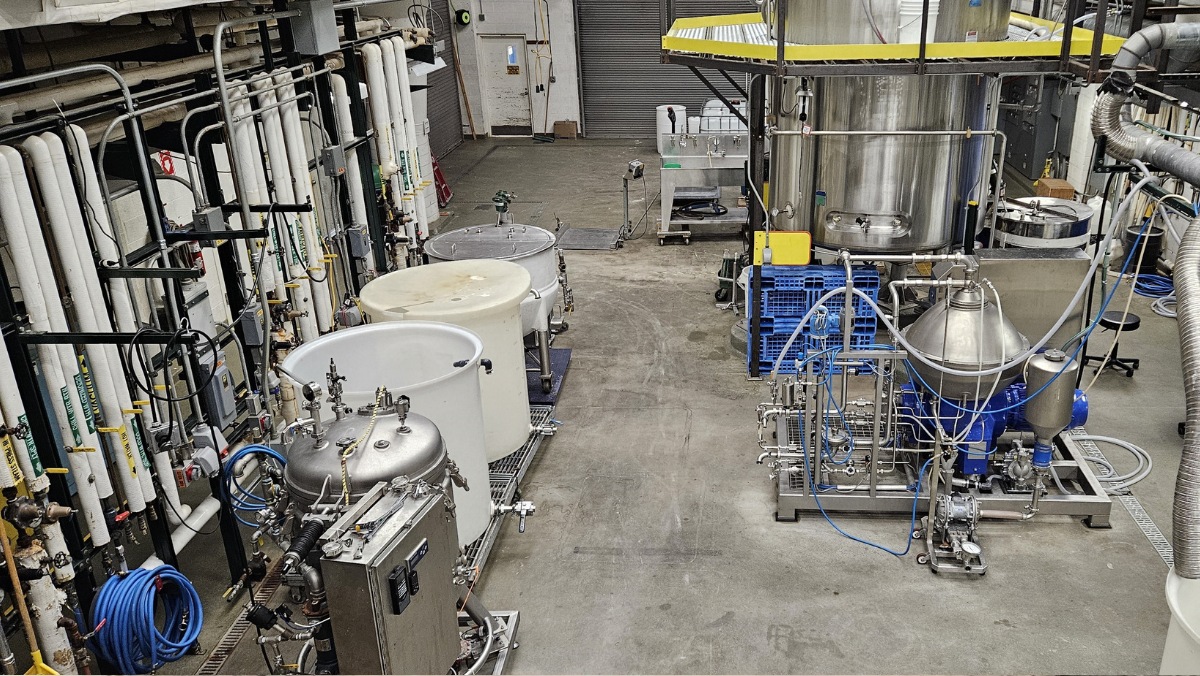 Industrial bioprocessing facility with stainless steel tanks and fermentation equipment
